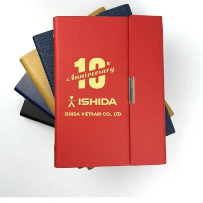 Ảnh thật nguồn sổ SC08 đỏ giữ số 10 Anniversary, biểu trưng ISHIDA và ISHIDA VIETNAM CO., LTD. cùng các bìa phía sau