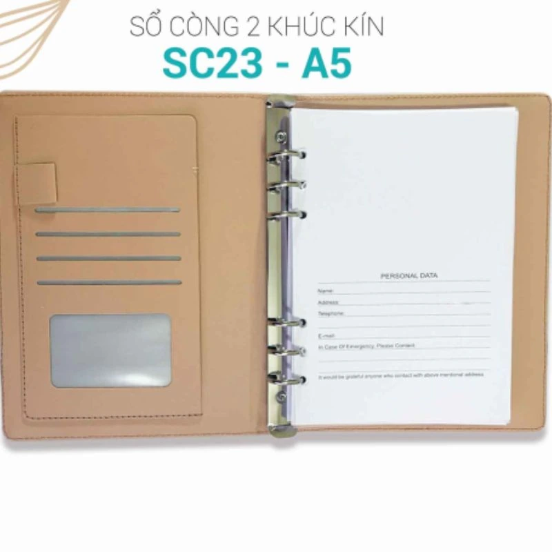 Hình nguồn giới thiệu mặt trong SC23-A5 với còng sáu vòng, các ngăn nâu vàng và trang PERSONAL DATA để trống